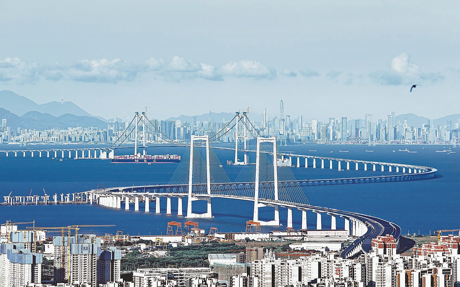 Greater Bay Area bridge and skyline representing the Hong Kong-Macao access pathway