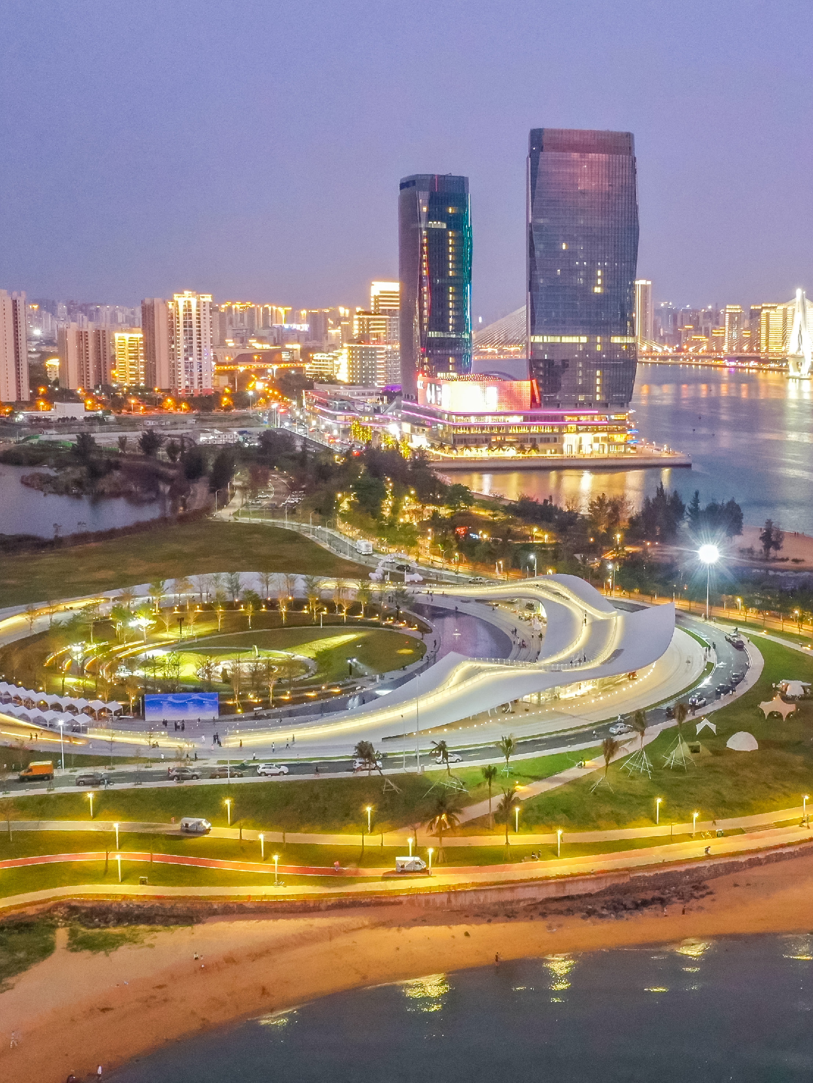 Sky Mountain coastal cultural landmark and Haikou skyline at night